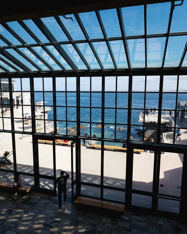 Museum interior with ocean view through glass ceiling