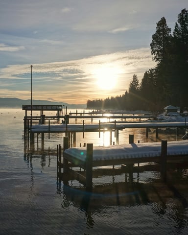 Lake Tahoe dock at dawn calm water mist