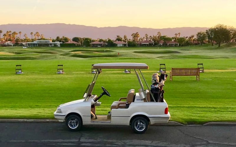 PGA West golf cart on the fairway at golden hour